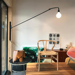 Cargar imagen en el visor de la Galería, Pivoting Long-Arm Black Wall Lamp room scene 2