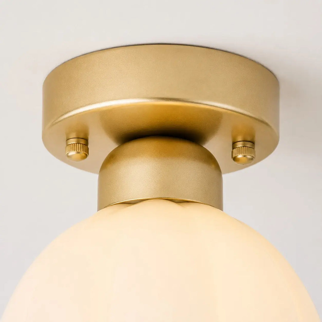Gold-finish ceiling canopy and mounting hardware detail