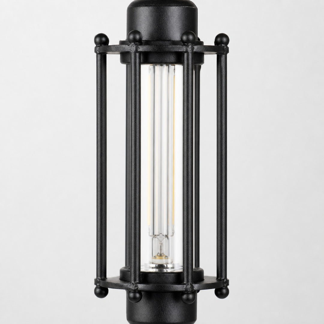 Close view of black tube guard frame and glass shade