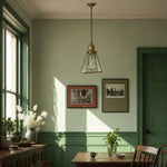 Load image into Gallery viewer, Clear glass brass pendant light in a green room near a window