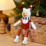 Cargar imagen en el visor de la Galería, Hand-carved wooden christmas polar bear ornament styled on a tabletop edge