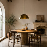 Bild in Gallery-Viewer laden, Brass dome pendant light above a round dining table