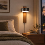 Load image into Gallery viewer, Walnut and black travertine wall sconce in an evening entry