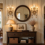 Load image into Gallery viewer, Two-light wall sconces framing a round mirror above an entry console