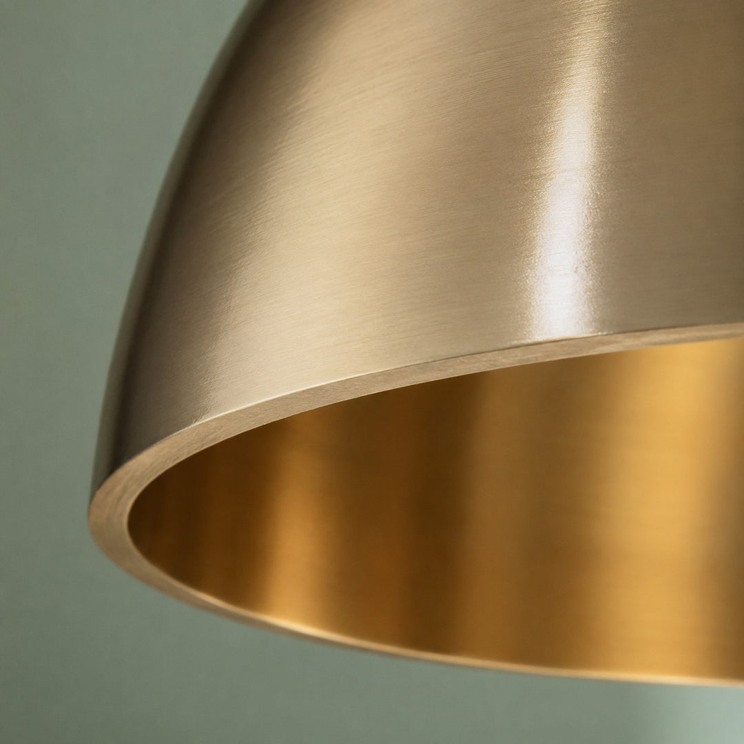 Warm inner brass finish on dome pendant shade