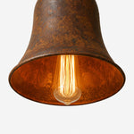 Charger l'image dans la visionneuse de galerie, Warm bulb glow below rust metal pendant shade