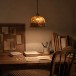 Bild in Gallery-Viewer laden, Paper pendant light above a warm reading desk