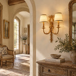Bild in Gallery-Viewer laden, Two-head brass and white wall sconce above a classic corridor console