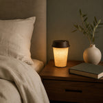 Load image into Gallery viewer, Rechargeable coffee-cup table lamp in a warm bedroom setting