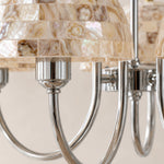 Cargar imagen en el visor de la Galería, Close view of beige shell mosaic shades and polished metal chandelier arms