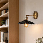 Bild in Gallery-Viewer laden, Black pleated ceramic wall sconce installed near a bookshelf
