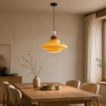 Bild in Gallery-Viewer laden, Caramel yellow glass pendant light above a dining table