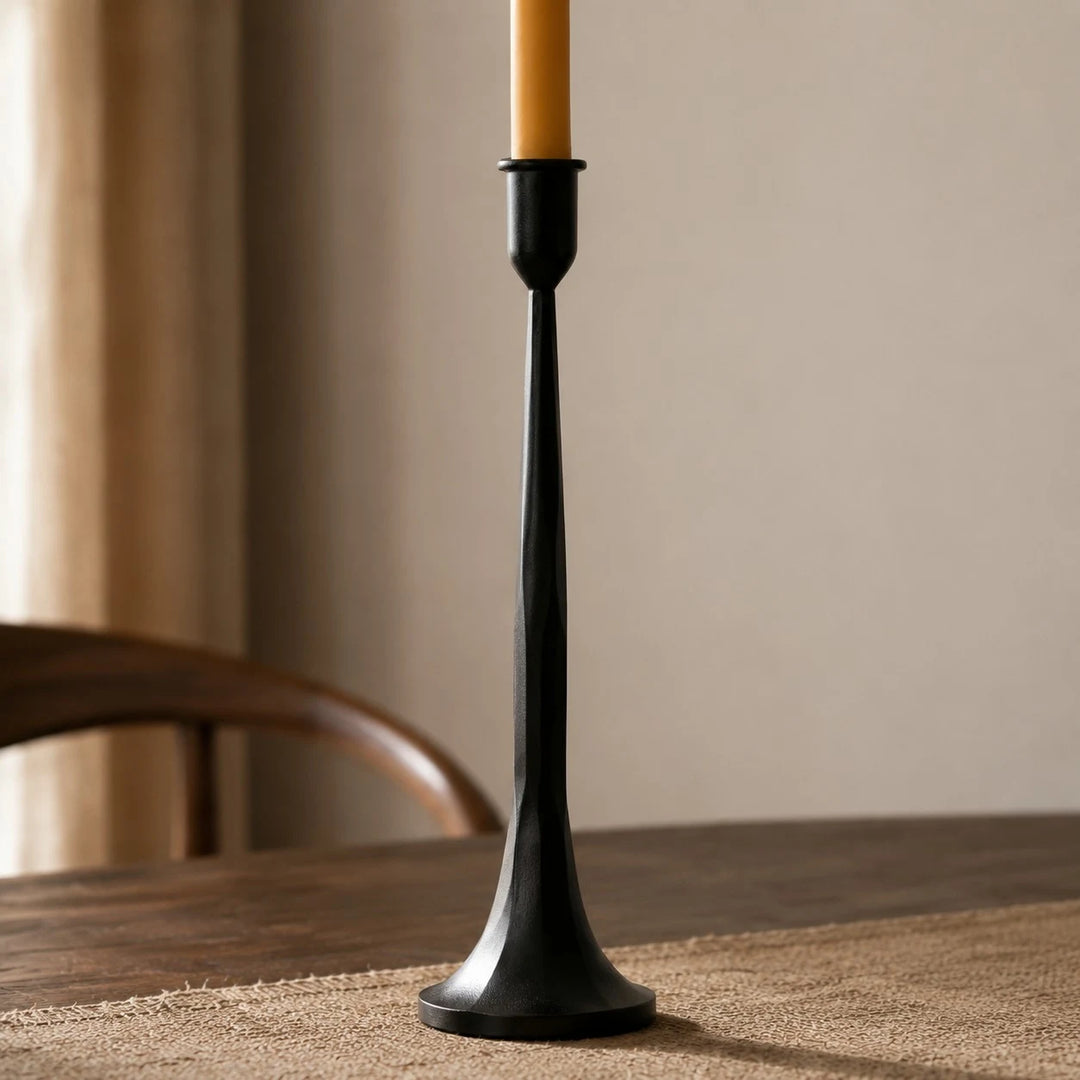 Single tall black iron candle holder profile with flared base