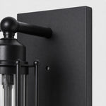 Load image into Gallery viewer, Close view of black metal backplate and arm
