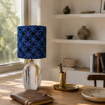 Load image into Gallery viewer, Blue patterned ceramic table lamp on a warm tabletop