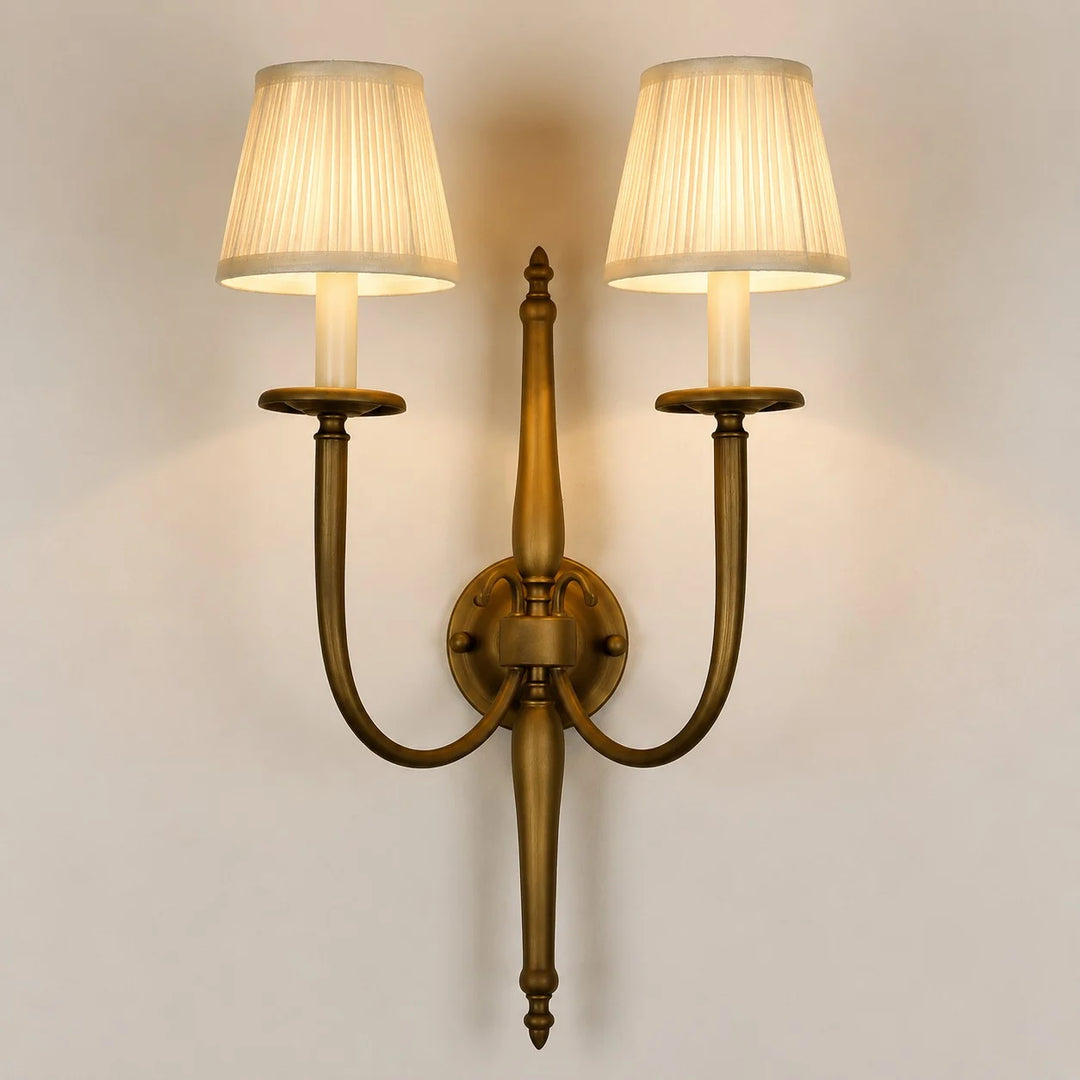 Front view of double arm wall sconce with pleated fabric shades