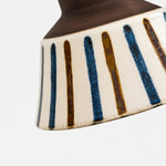 Load image into Gallery viewer, Close view of the striped ceramic glaze and warm brown rim