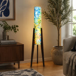 Load image into Gallery viewer, Blue botanical tripod floor lamp illuminating a quiet interior