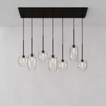 Load image into Gallery viewer, Lumivelle Sculptural 7-Light Chandelier – Adjustable Height Modern Glass Pendant
