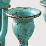 Load image into Gallery viewer, Close view of blue-green branch candle cup and patina