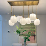 Load image into Gallery viewer, Lumivelle Sculptural 7-Light Chandelier – Adjustable Height Modern Glass Pendant
