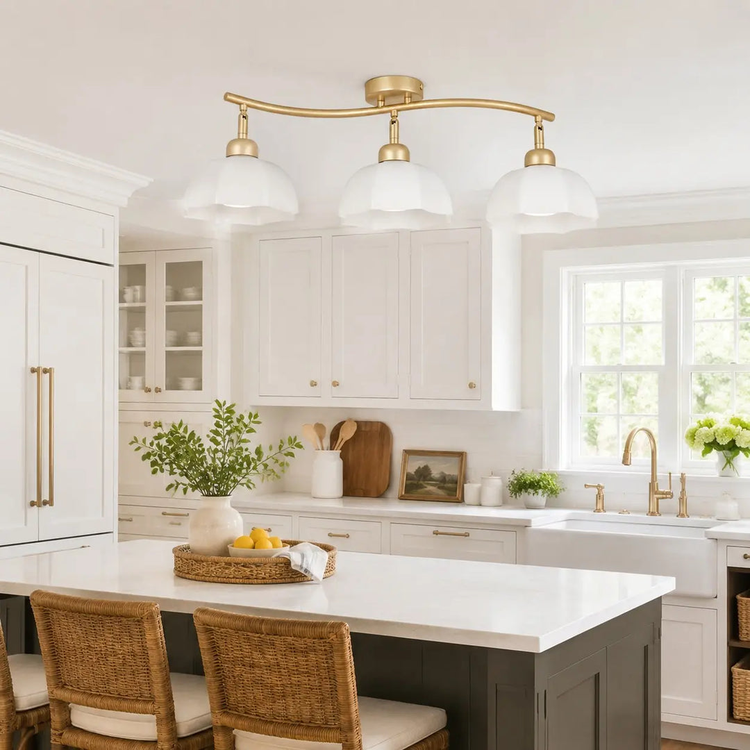Gold 3-light ceiling fixture in a white kitchen