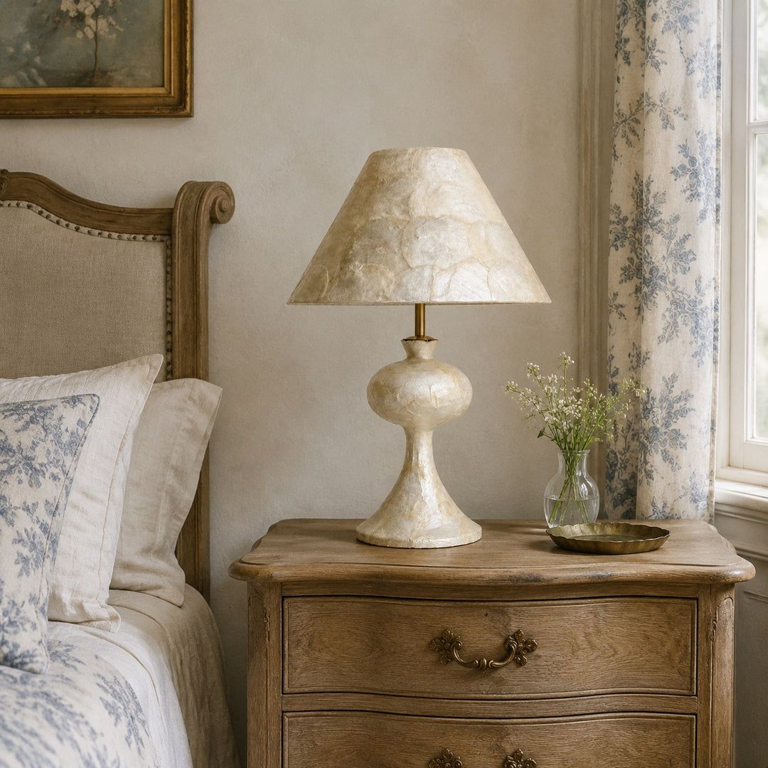 Capiz shell table lamp in a vintage bedroom setting