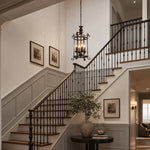 Load image into Gallery viewer, Black iron pendant installed over a stair landing