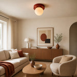 Load image into Gallery viewer, Memphis red LED ceiling light above a calm living area