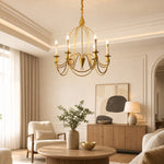 Load image into Gallery viewer, Gold six-light candle chandelier in a warm living space