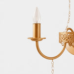 Load image into Gallery viewer, Close view of the curved candle arm and antique brass finish