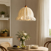 Ruffled fabric pendant over a dining corner
