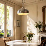 Charger l'image dans la visionneuse de galerie, Polished chrome pendant light above a round table by tall windows