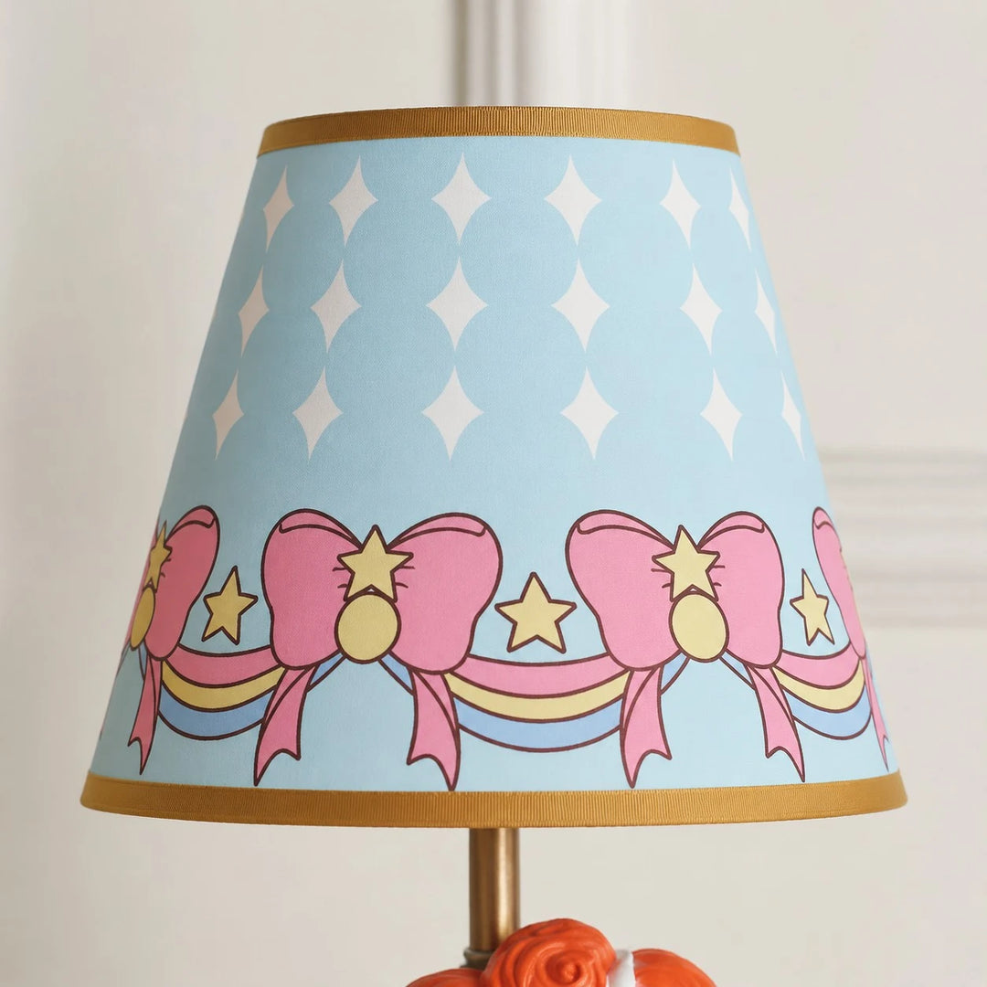 Blue printed fabric shade detail with bows and stars