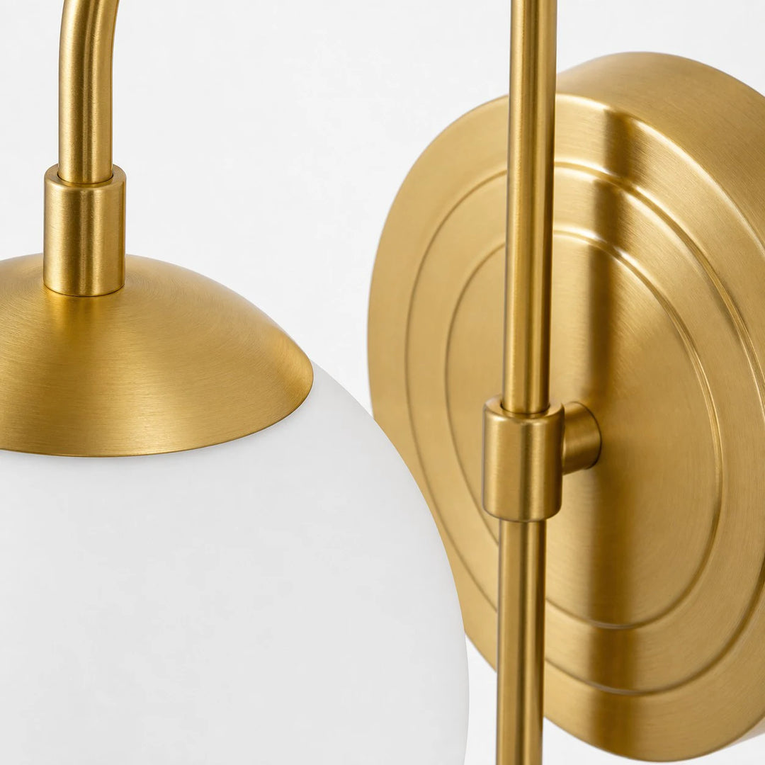 Gold metal shade holder and adjustable arm detail