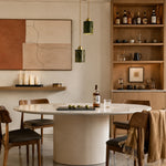 Load image into Gallery viewer, Two green jade cylinder pendant lights above a warm wood and marble dining table