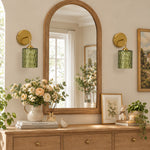 Cargar imagen en el visor de la Galería, Green hammered-glass sconces on a wood console, lights off