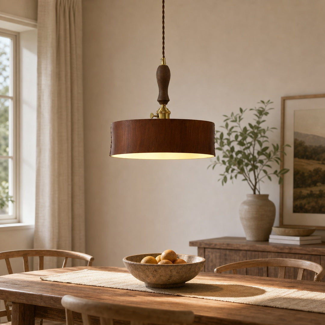 Vintage brown leather pendant installed above a wood dining table