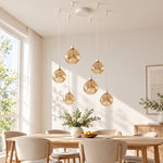 Charger l'image dans la visionneuse de galerie, White six-light glass pendant over a dining table in daylight