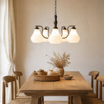 Bild in Gallery-Viewer laden, Five-heads chandelier above a wood dining table