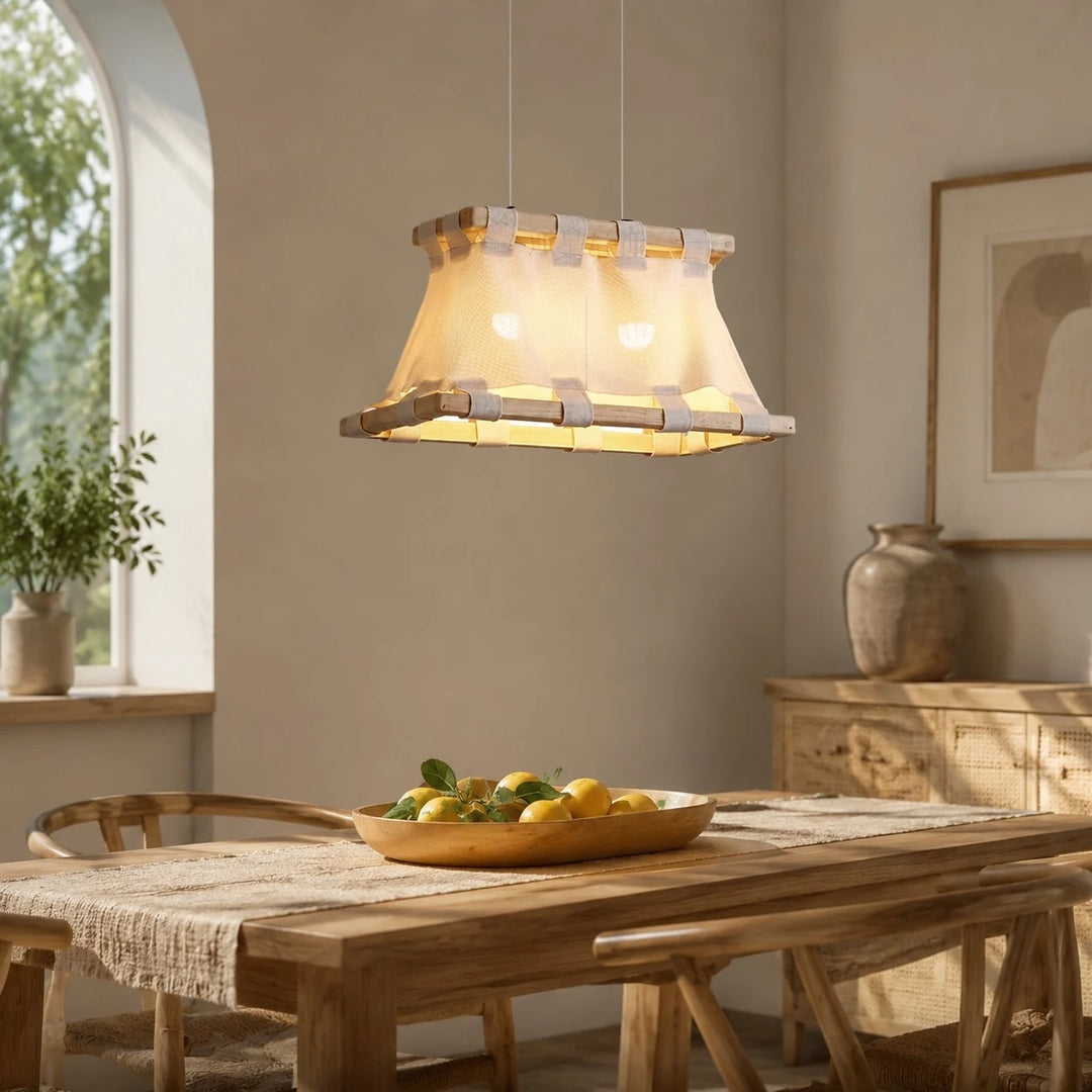 Pendant lamp scale above long dining table