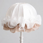 Bild in Gallery-Viewer laden, Close-up of layered white and blush ruffles on the gathered fabric lampshade