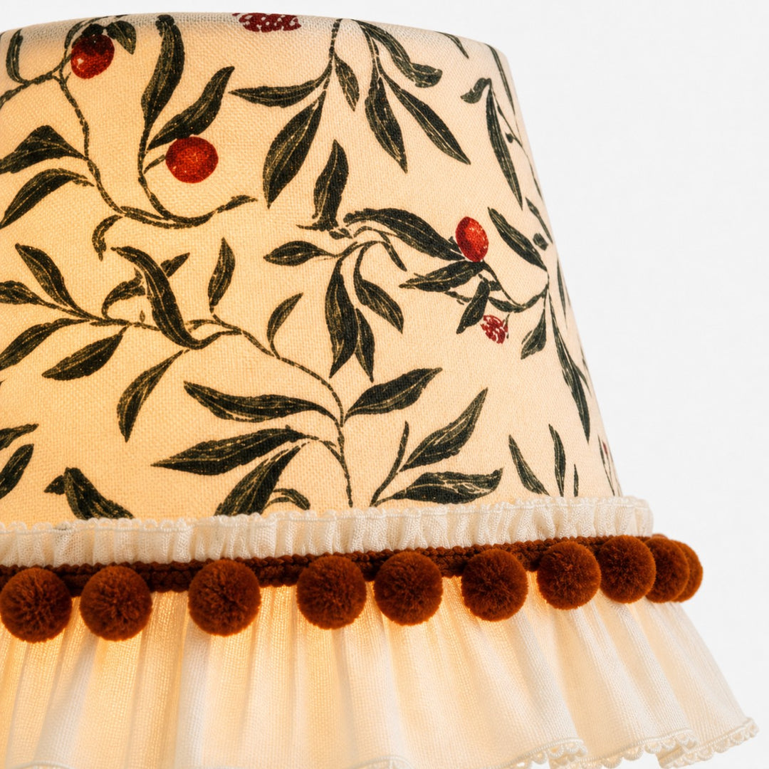 Botanical fabric shade with pom-pom trim