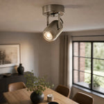 Cargar imagen en el visor de la Galería, Sand nickel wall lamp used as warm accent lighting in a dining room