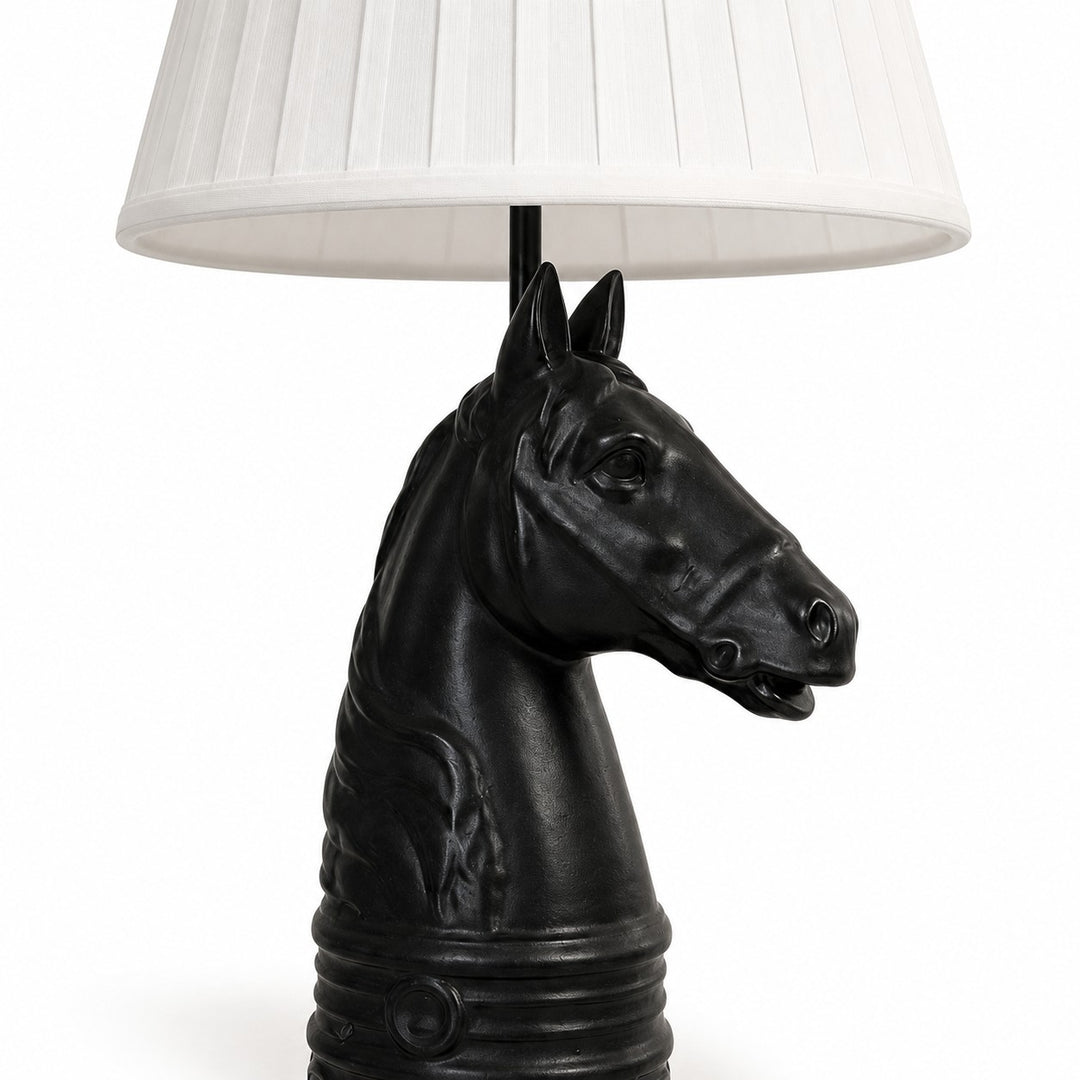 Close detail of black horse head table lamp base
