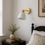 Load image into Gallery viewer, White ceramic wall sconce installed beside a bedside table