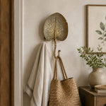 Cargar imagen en el visor de la Galería, Antique-gold botanical wall hook in an entryway