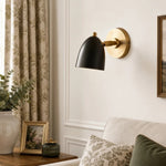 Charger l'image dans la visionneuse de galerie, Black and gold wall sconce in a styled room