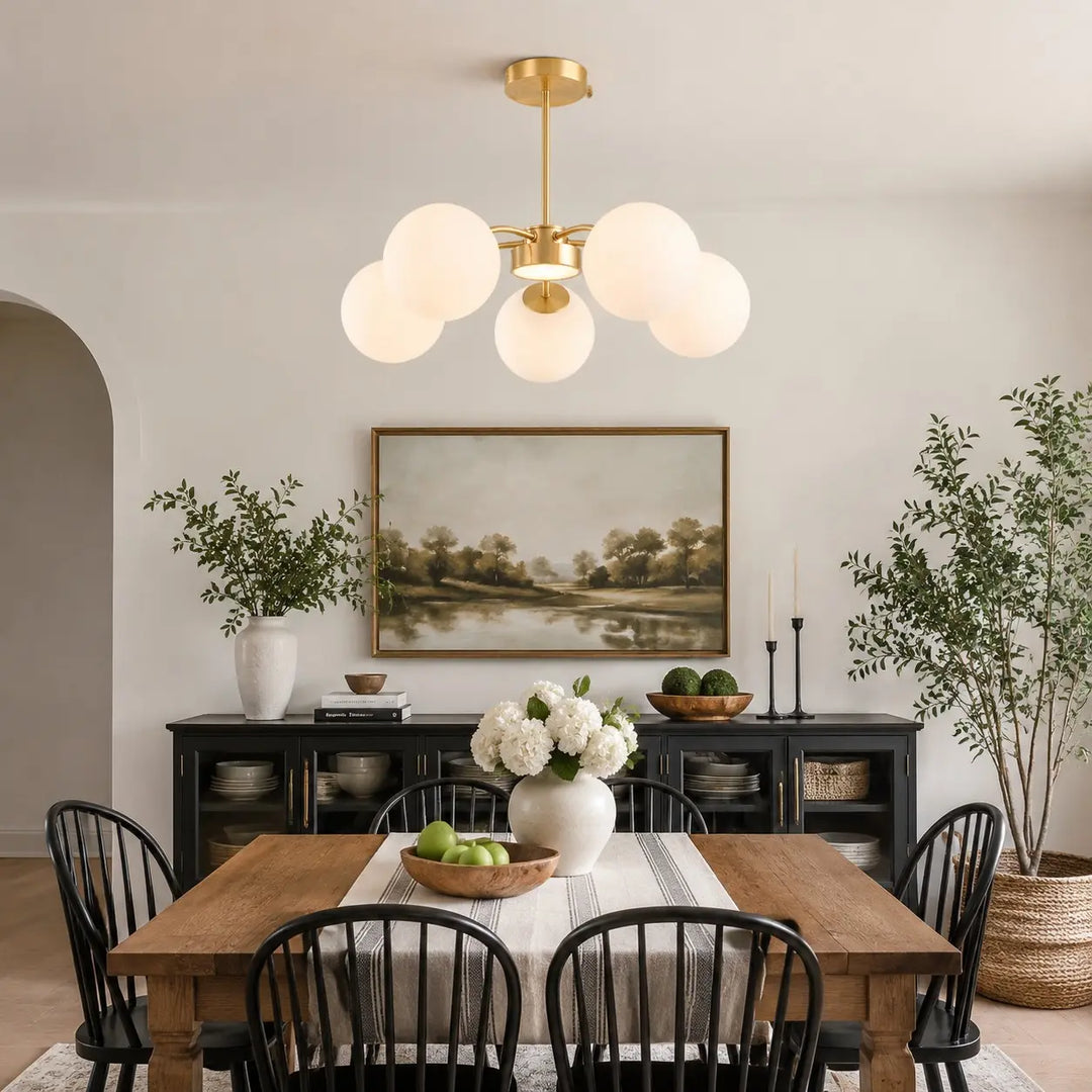 Gold five-light chandelier in a dining room