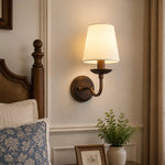Cargar imagen en el visor de la Galería, Antique bronze wall sconce installed beside a bed